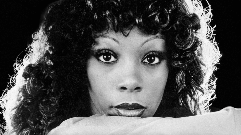A portrait of 1970s icon Donna Summer looking at the camera.