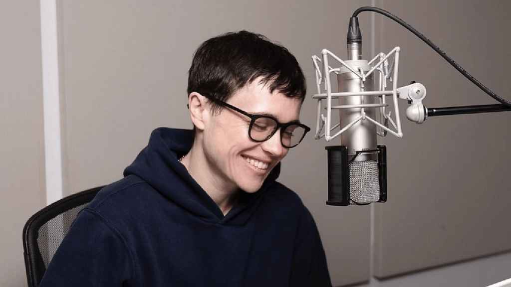 Actor Elliot Page laughing at a microphone