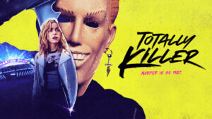 A young woman looks over her shoulder reflected in the blade of a man wearing a creepy Max Headroom style mask.